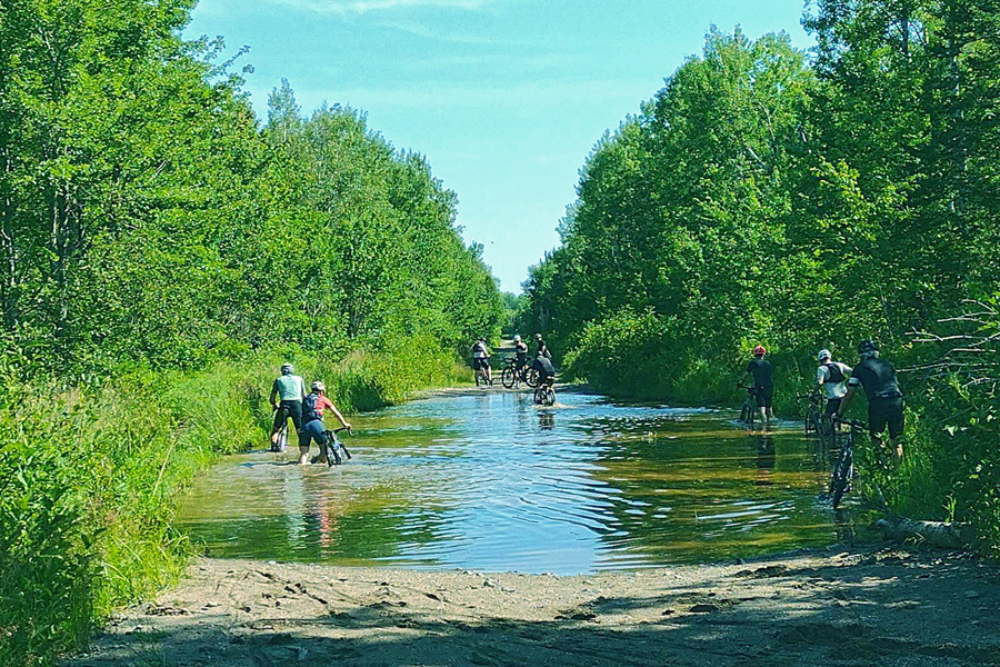 Cycling through a deep puddle.